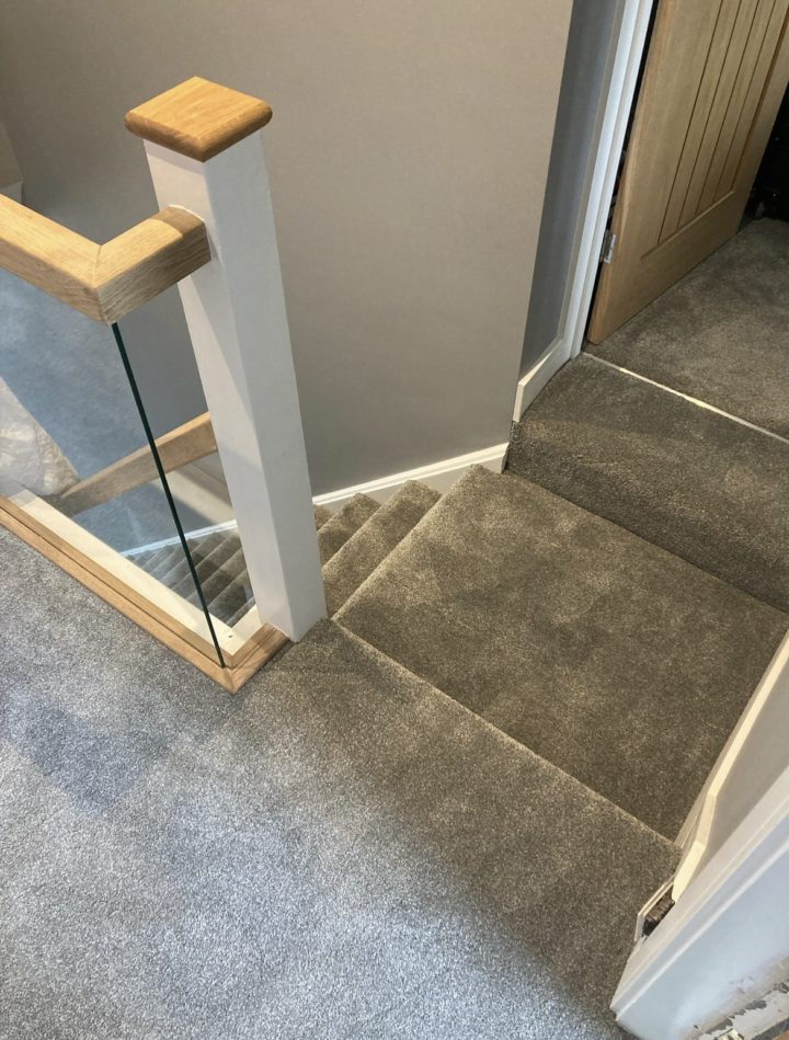 Newly fitted grey carpet on stairs