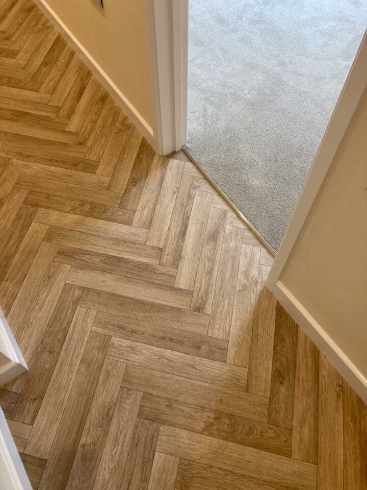 Herringbone wood floor in hallway